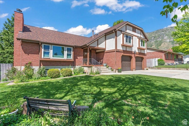 561 E 2780 N, Provo, UT 84604 - english style home with brick siding, concrete driveway, a chimney, a garage, and a shingled roof
