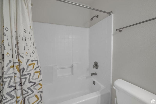 full bathroom with toilet and shower / tub combo