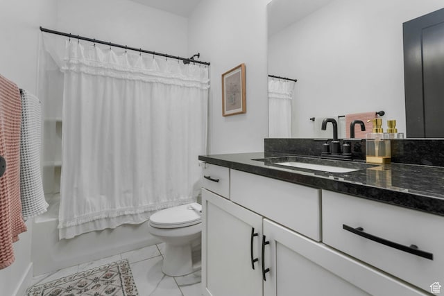 full bath with toilet, vanity, and shower / bath combo with shower curtain