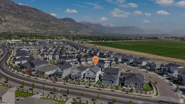 aerial view of residential area featuring a mountainous background
