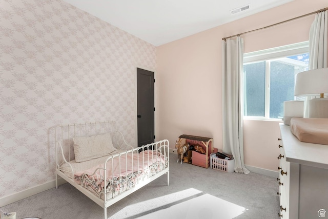 carpeted bedroom featuring baseboards