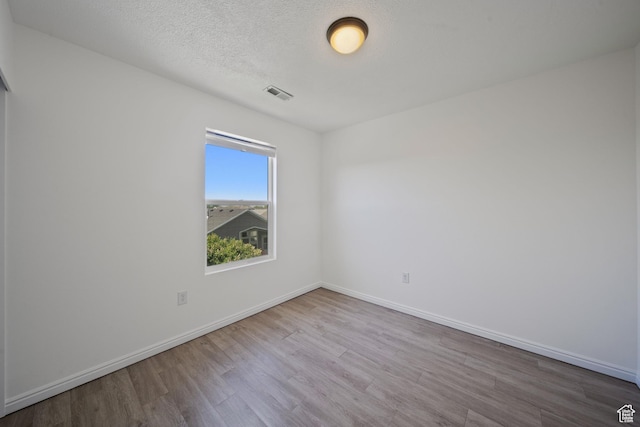 1957 N 2225 W, Clinton, UT 84015 - empty room featuring wood finished floors and baseboards