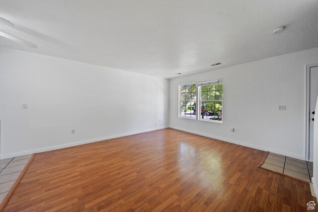 1957 N 2225 W, Clinton, UT 84015 - spare room with wood finished floors, a smoke detector, and baseboards