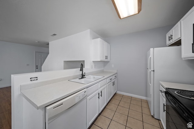 1957 N 2225 W, Clinton, UT 84015 - kitchen featuring white dishwasher, a sink, a peninsula, and white cabinetry