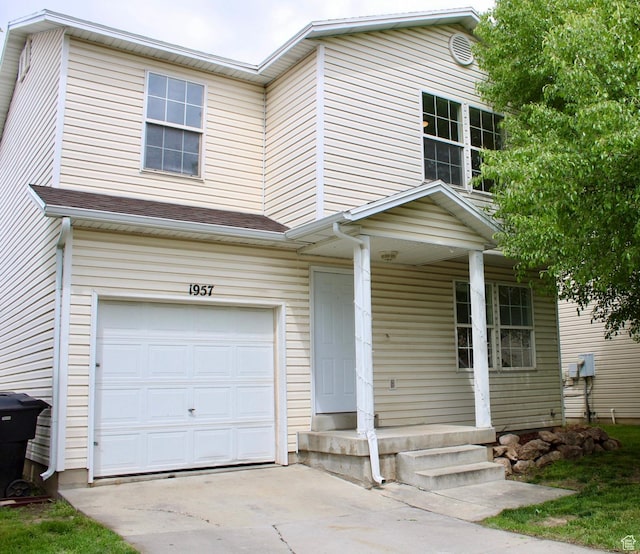 1957 N 2225 W, Clinton, UT 84015 - view of front of property with an attached garage, a porch, and driveway