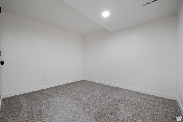 carpeted spare room with baseboards