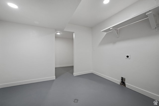 laundry room with hookup for an electric dryer, recessed lighting, and baseboards