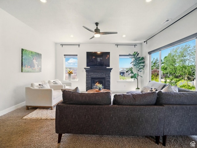 living area featuring recessed lighting, a fireplace, carpet floors, baseboards, and a ceiling fan