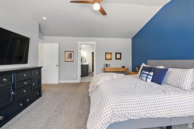 bedroom featuring carpet, lofted ceiling, baseboards, and a ceiling fan
