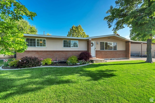 1597 W 1050 N, Provo, UT 84604 - ranch-style home with brick siding and a front lawn