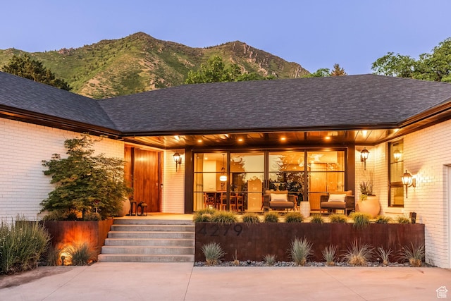 4279 S Lares Cir, Salt Lake City, UT 84124 - entrance to property with a mountain view, covered porch, and brick siding