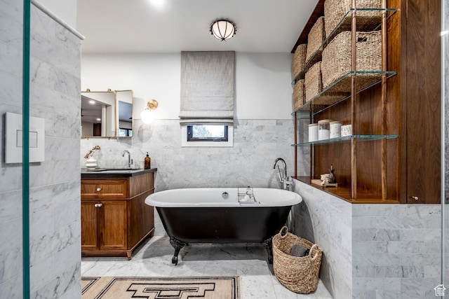 4279 S Lares Cir, Salt Lake City, UT 84124 - bathroom featuring a freestanding bath, vanity, and tile walls