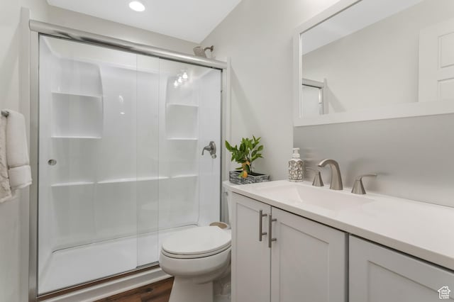 9559 S Lea Heather Way, West Jordan, UT 84081 - full bath featuring a shower stall, vanity, toilet, wood finished floors, and recessed lighting