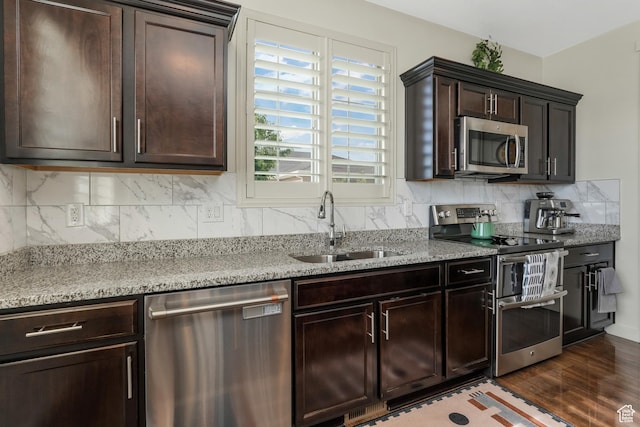 9559 S Lea Heather Way, West Jordan, UT 84081 - kitchen featuring stainless steel appliances, a sink, dark wood-style floors, and dark brown cabinetry