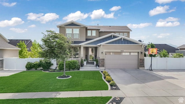 9559 S Lea Heather Way, West Jordan, UT 84081 - craftsman-style house with stone siding, concrete driveway, a garage, a gate, and board and batten siding