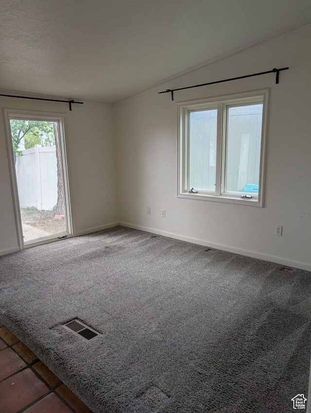 unfurnished room featuring carpet flooring and baseboards