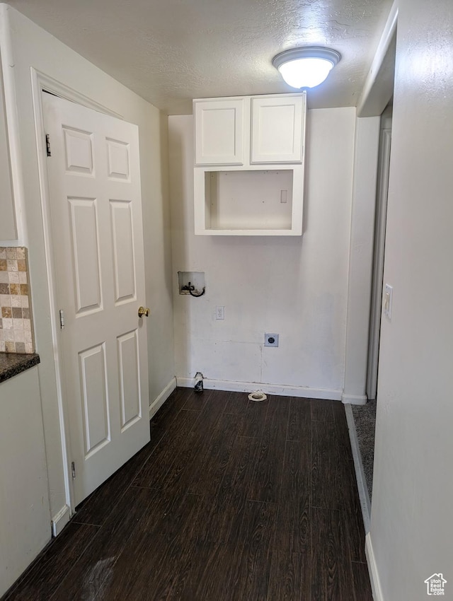 laundry room with hookup for a washing machine, dark wood-style floors, electric dryer hookup, cabinet space, and baseboards