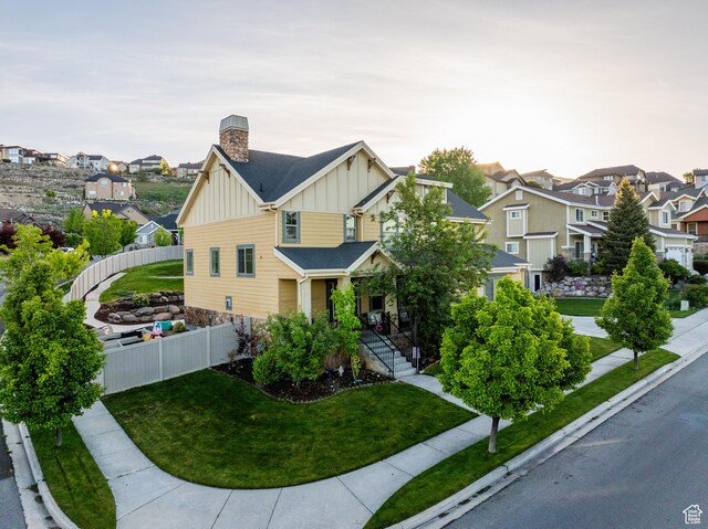 2706 W Falcon Ridge Way, Lehi, UT 84043 - craftsman house with board and batten siding, a residential view, and a chimney