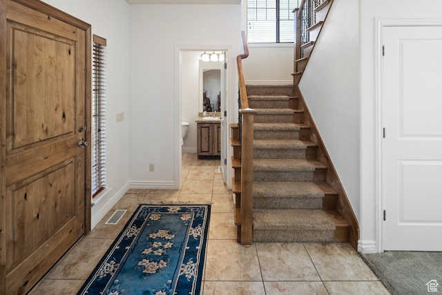 2706 W Falcon Ridge Way, Lehi, UT 84043 - foyer entrance featuring stairway, baseboards, and light tile patterned floors