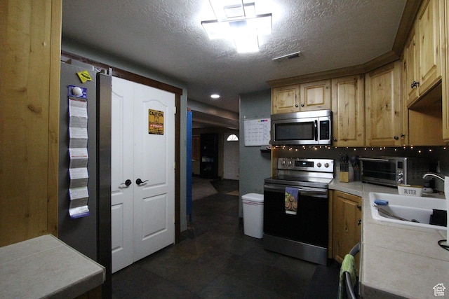 463 E 200 N, Mapleton, UT 84664 - kitchen featuring range with electric stovetop, stainless steel microwave, tile countertops, and a textured ceiling