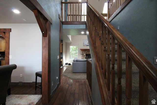 463 E 200 N, Mapleton, UT 84664 - stairs featuring hardwood / wood-style floors, a stone fireplace, a high ceiling, and recessed lighting