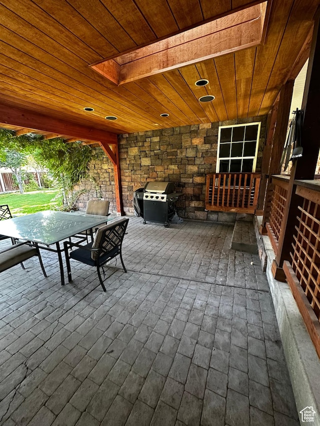 view of patio / terrace with a grill, outdoor dining space, and a deck