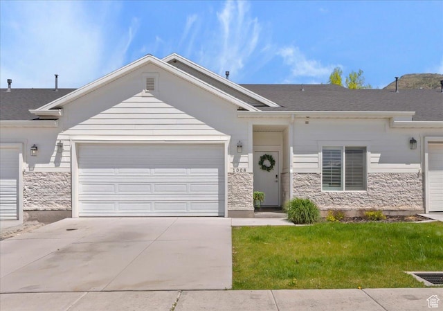 1008 N Vista Loop, Morgan, UT 84050 - ranch-style home with stone siding, concrete driveway, a garage, and a front lawn