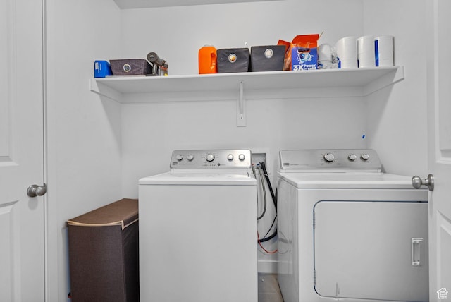washroom featuring independent washer and dryer