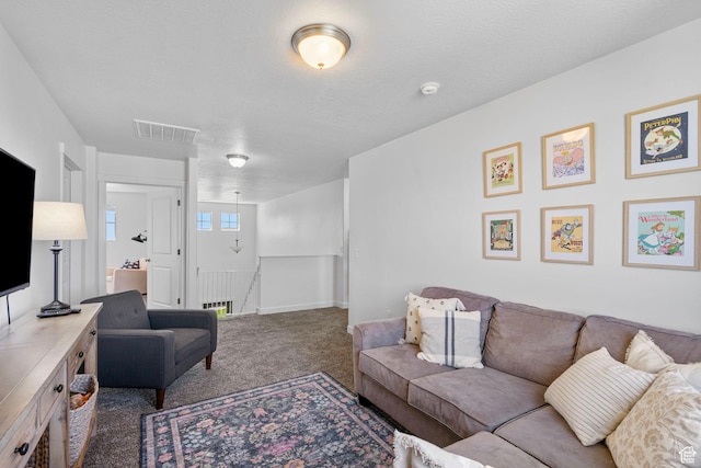 carpeted living room with baseboards