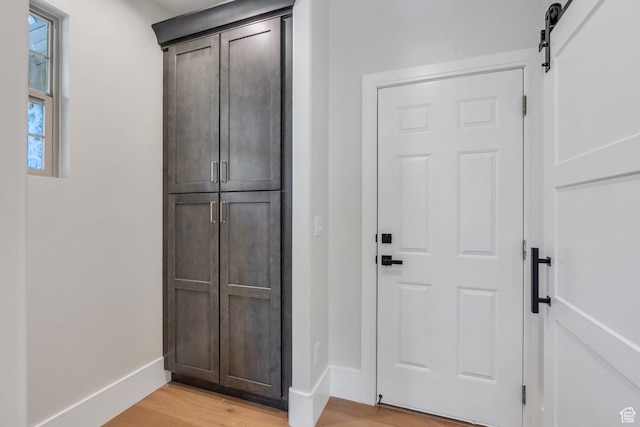 1309 W 1870 N, Provo, UT 84604 - entryway featuring light wood-style flooring, baseboards, and a barn door