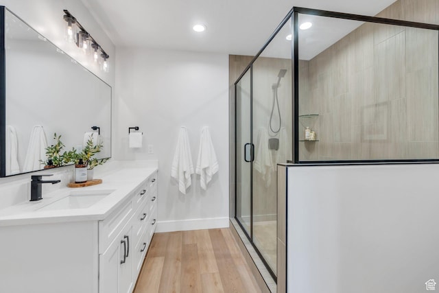 1309 W 1870 N, Provo, UT 84604 - bathroom featuring vanity, recessed lighting, a shower stall, wood finished floors, and baseboards