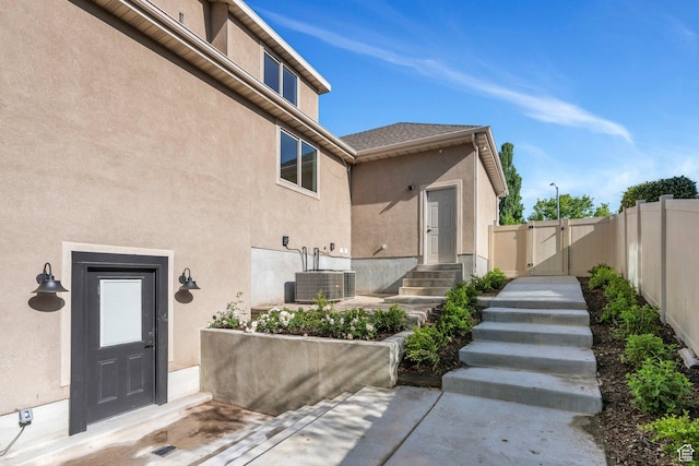 1309 W 1870 N, Provo, UT 84604 - property entrance with a gate, central AC unit, stucco siding, fence, and a patio area