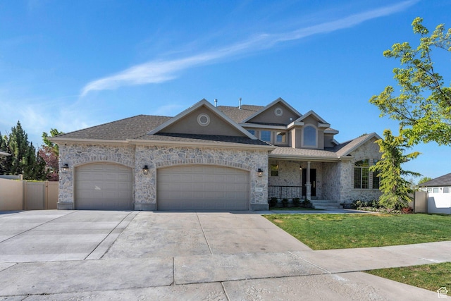 1309 W 1870 N, Provo, UT 84604 - view of front of home with an attached garage, concrete driveway, a porch, stone siding, and roof with shingles