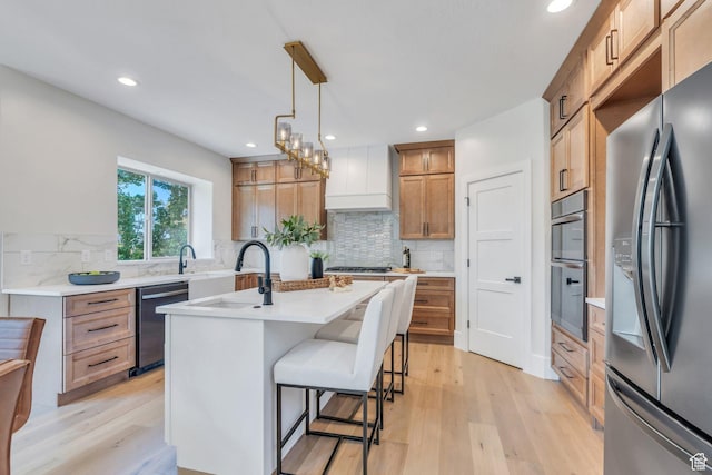 1309 W 1870 N, Provo, UT 84604 - kitchen with appliances with stainless steel finishes, light wood finished floors, custom exhaust hood, recessed lighting, and backsplash