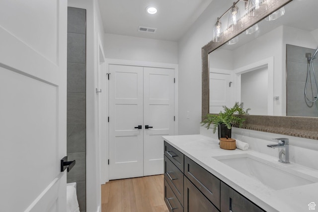 1309 W 1870 N, Provo, UT 84604 - bathroom with vanity, wood finished floors, tiled shower, and recessed lighting