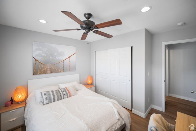 bedroom with wood finished floors, baseboards, recessed lighting, a closet, and a ceiling fan