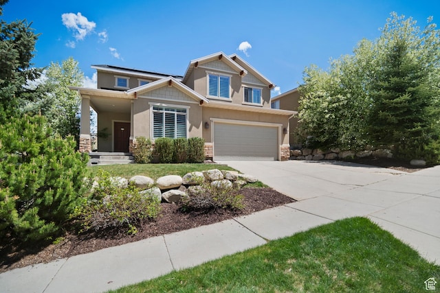 craftsman-style home with stone siding, concrete driveway, roof mounted solar panels, and a garage