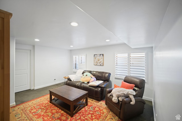 carpeted living room featuring recessed lighting and baseboards