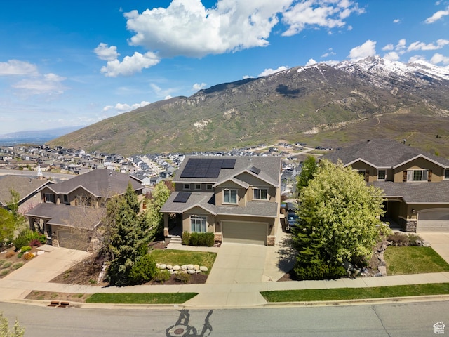 view of mountain background featuring nearby suburban area