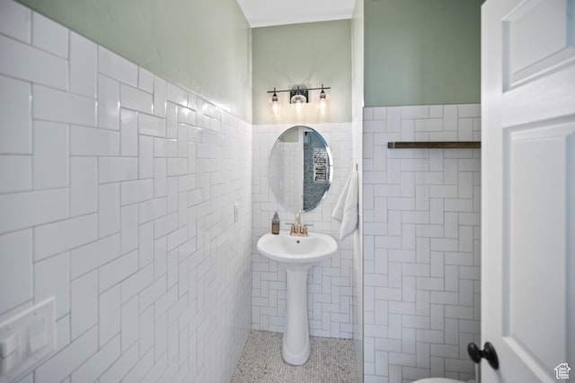 bathroom with tile walls and wainscoting
