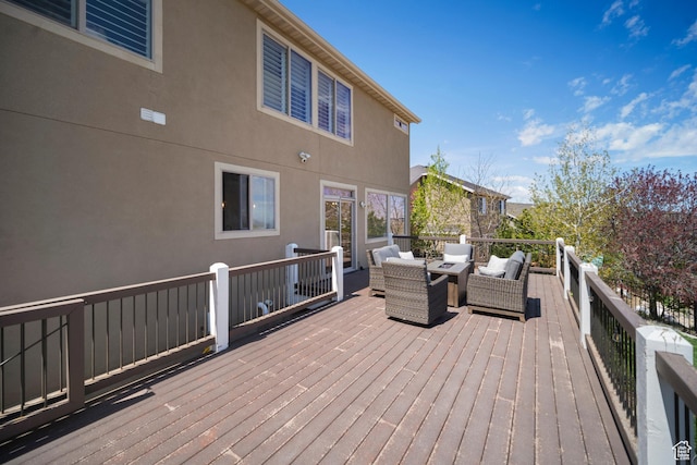 wooden terrace with an outdoor hangout area
