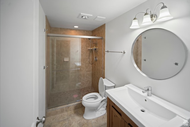 full bathroom with a shower stall, toilet, vanity, and tile patterned flooring