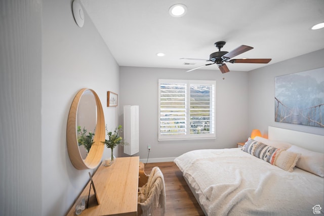 bedroom featuring recessed lighting, wood finished floors, baseboards, and a ceiling fan