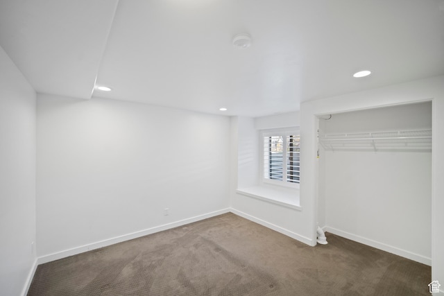 unfurnished bedroom featuring carpet floors, recessed lighting, a closet, and baseboards