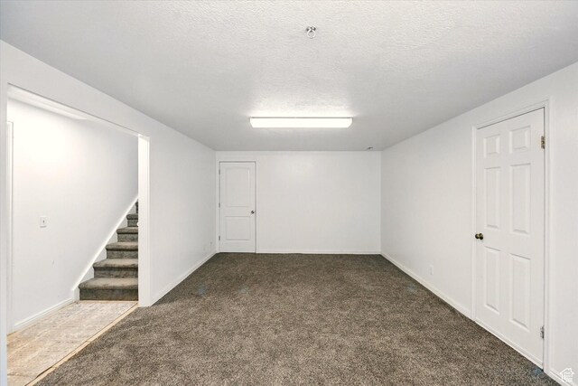 621 N 300 E, Brigham City, UT 84302 - finished basement with carpet, stairway, a textured ceiling, and baseboards