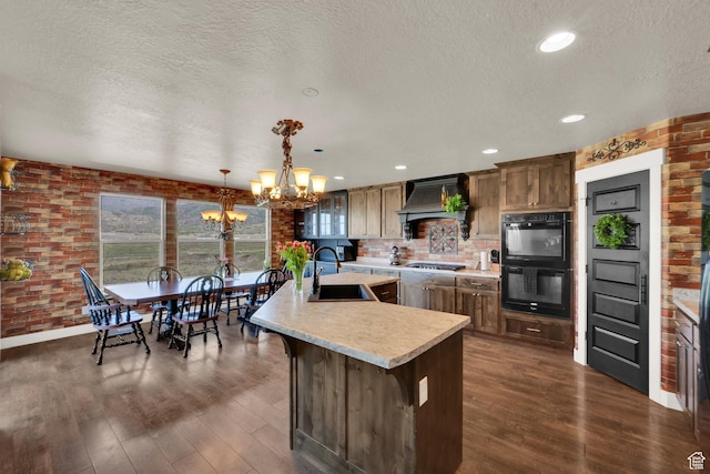 1341 S Sageberry Dr, Santaquin, UT 84655 - kitchen featuring a chandelier, light countertops, a textured ceiling, dark wood-style floors, and a sink