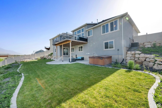 1341 S Sageberry Dr, Santaquin, UT 84655 - back of house with a hot tub, central AC unit, a patio, stucco siding, and a deck