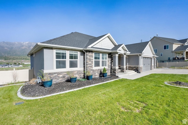 1341 S Sageberry Dr, Santaquin, UT 84655 - craftsman house featuring stone siding, concrete driveway, an attached garage, and roof with shingles