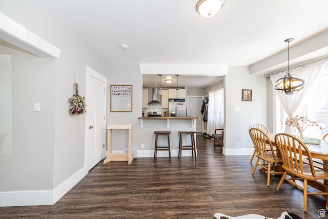 141 W 400 N, Logan, UT 84321 - dining room featuring dark wood finished floors, baseboards, and a chandelier