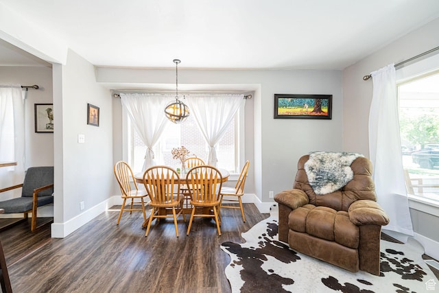 141 W 400 N, Logan, UT 84321 - dining room featuring dark wood-style floors, baseboards, and a chandelier